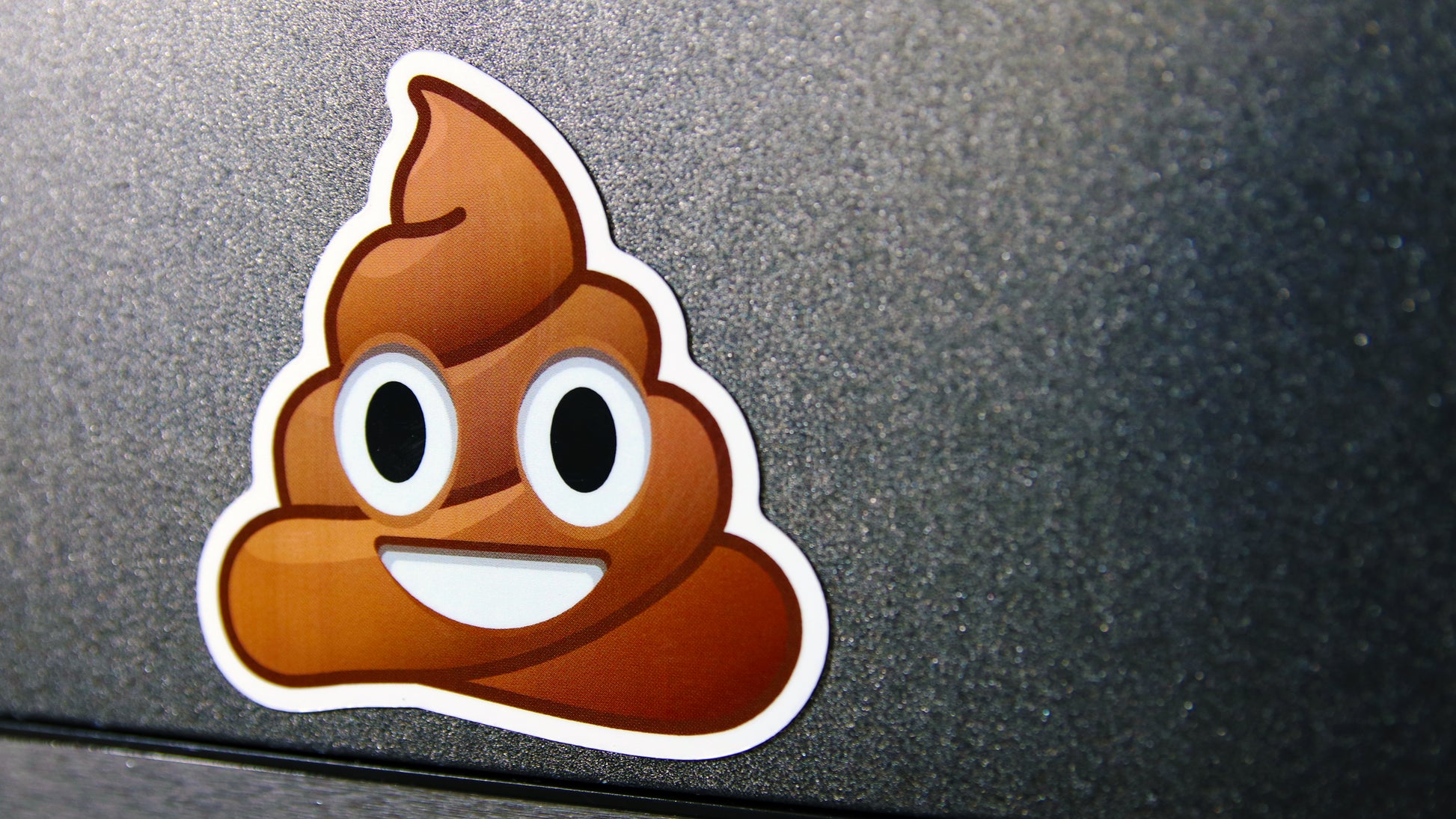 Die-cut poop emoji magnet printed on white