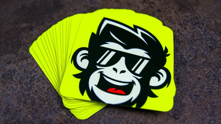 http://stickerit.co/cdn/shop/products/Rounded-corner-fluorescent-yellow-stickers-with-monkey-design-on-a-table.jpg?v=1680771971