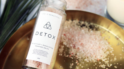 Rectangle biodegradable paper samples with detox design applied to a clear glass jar filled with soaking salts