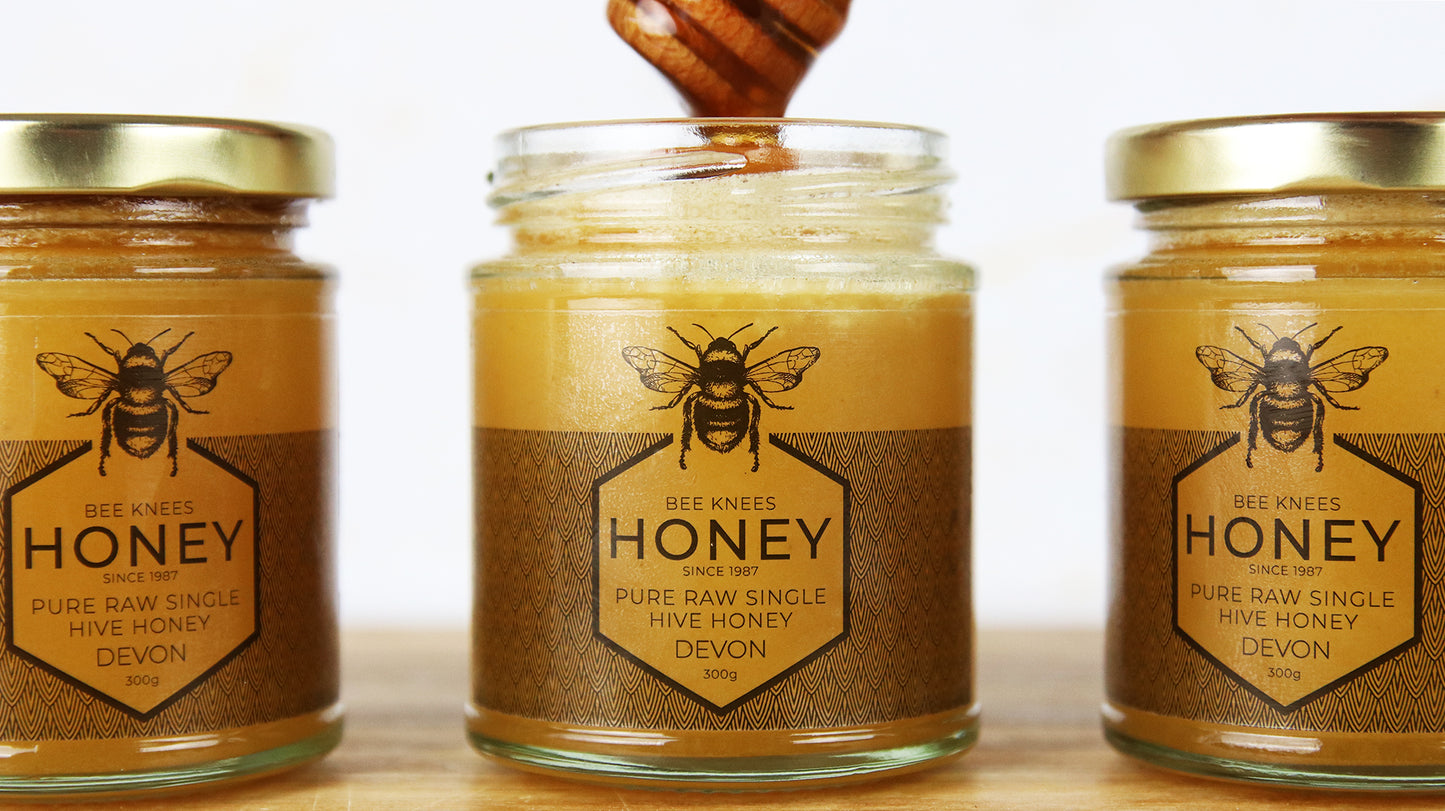 Rectangular clear samples applied to three honey jars in a row