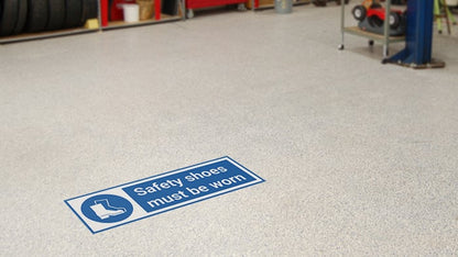 Rectangular safety floor sticker applied in a workshop