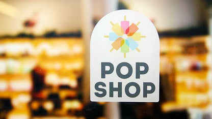 Window cling with pop shop logo applied to a window