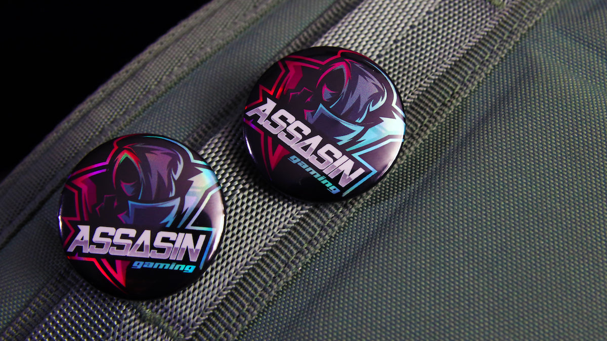 32mm (1.25 inch) holographic button badge printed with a custom gaming design