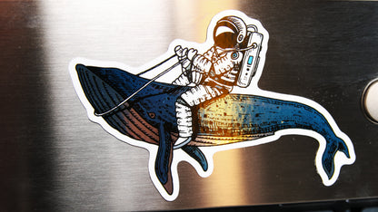 Silver metallic custom shaped magnet with a spaceman design printed onto it