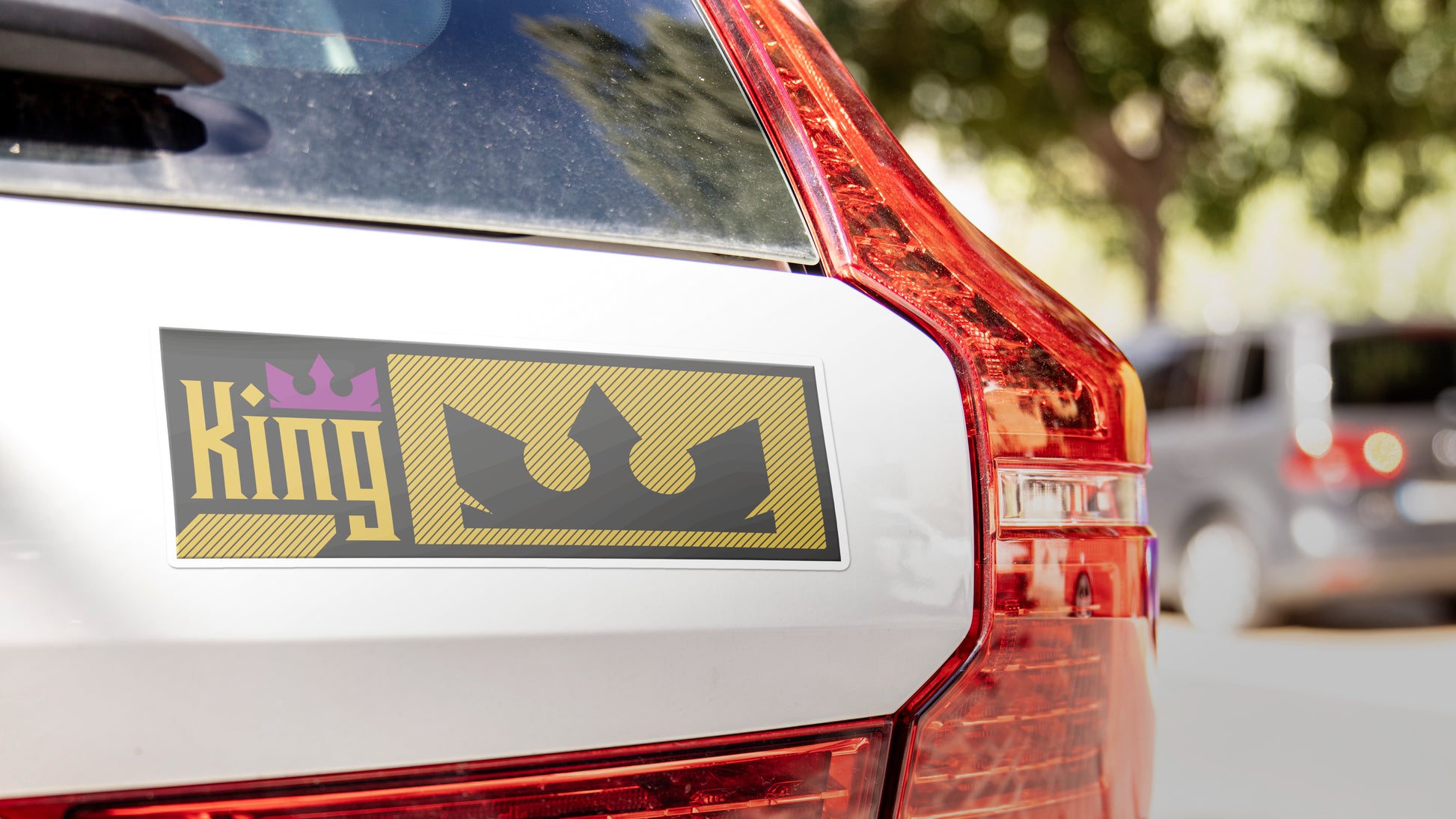 Rectangle car magnet with king car logo applied to a bumper