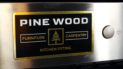 Kitchen logo printed on a gold magnet applied to a cooker