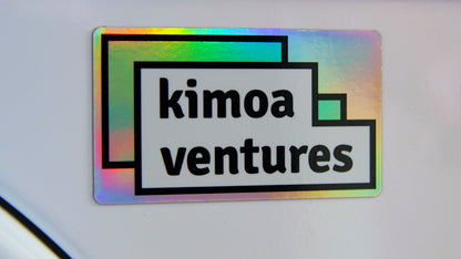 Rounded corner Kimoa Ventures custom printed magnet stuck to a white fridge
