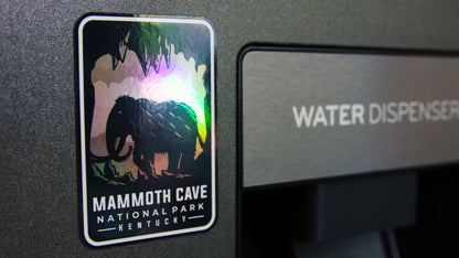 Rounded corner magnet stuck to a water dispenser printed with a National park design