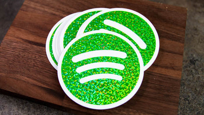 Stack of circle glitter sticker with green Spotify logo