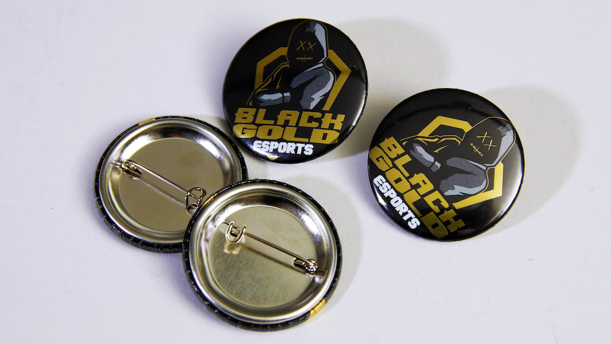 Black & gold Esports logo on four 37mm (1.5 inch) badges