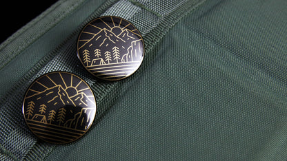 Black and gold retro Adventure logo design printed on a gold button badge 32mm (1.25 inches) in size