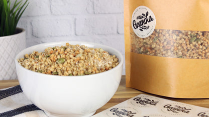 Eco-friendly label with granola design applied to a brown bag of granola next to a bowl of granola