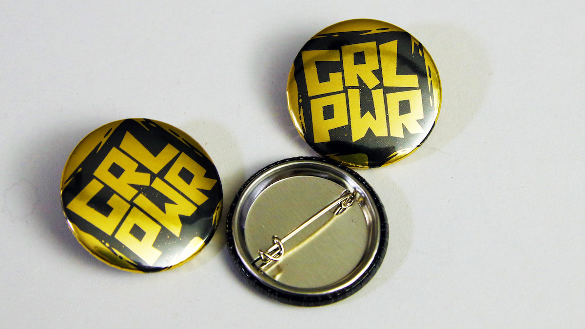 Girl Power gold branding on a 25mm (1-inch) small button badge