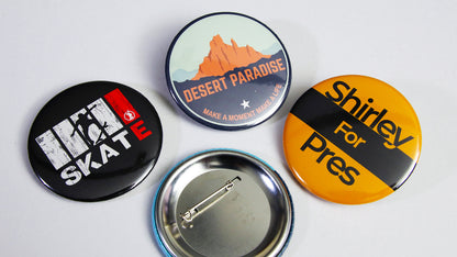 Large 58mm (2.25 inch) custom standard button badges printed with various promotional designs