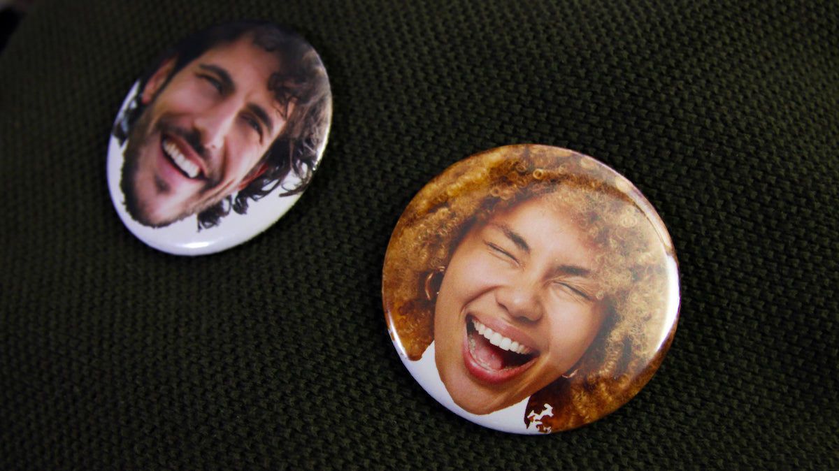 Photos of happy smiley faces on 2.25 inch (58mm) badges