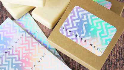 Recyclable holographic sheet labels with victoria west logo applied to cardboard soap boxes