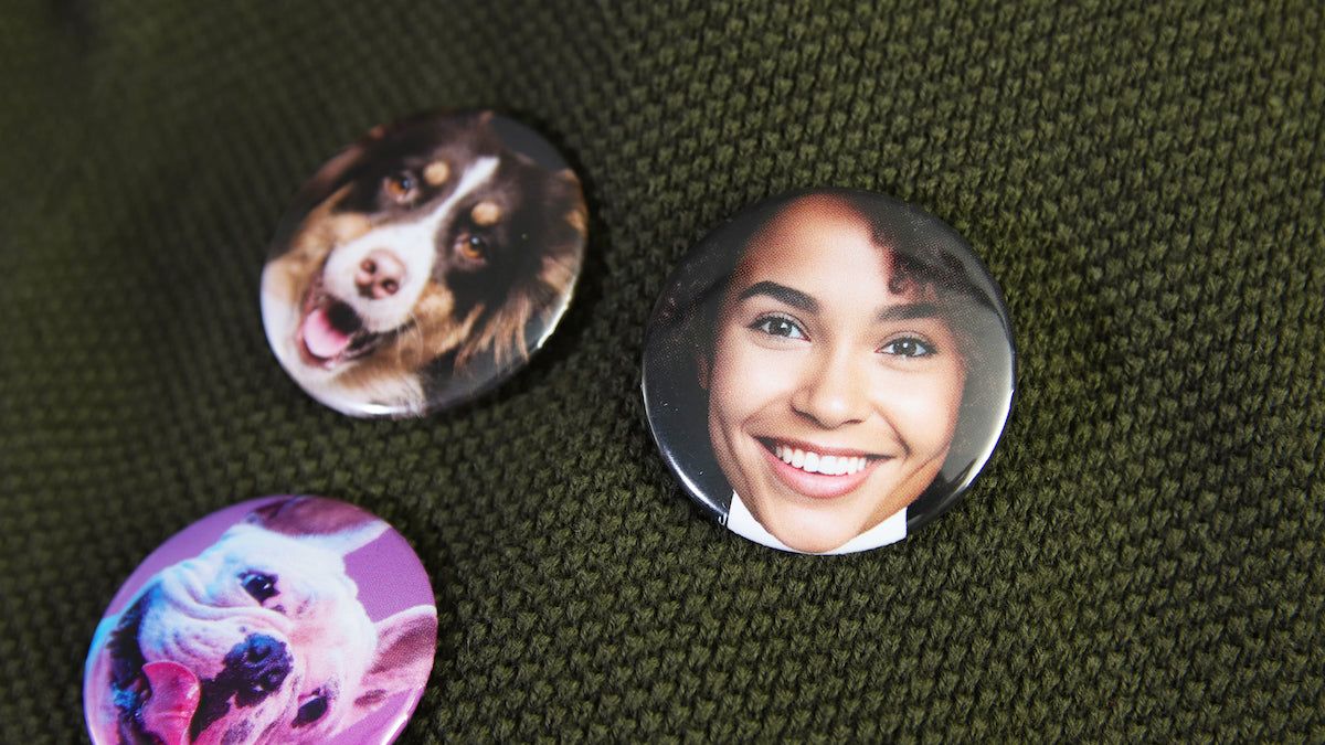 Various face photo button badges on 37mm (1.5-inch) sized badges