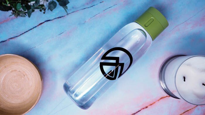 Black transfer sticker with custom design applied to a clear water bottle