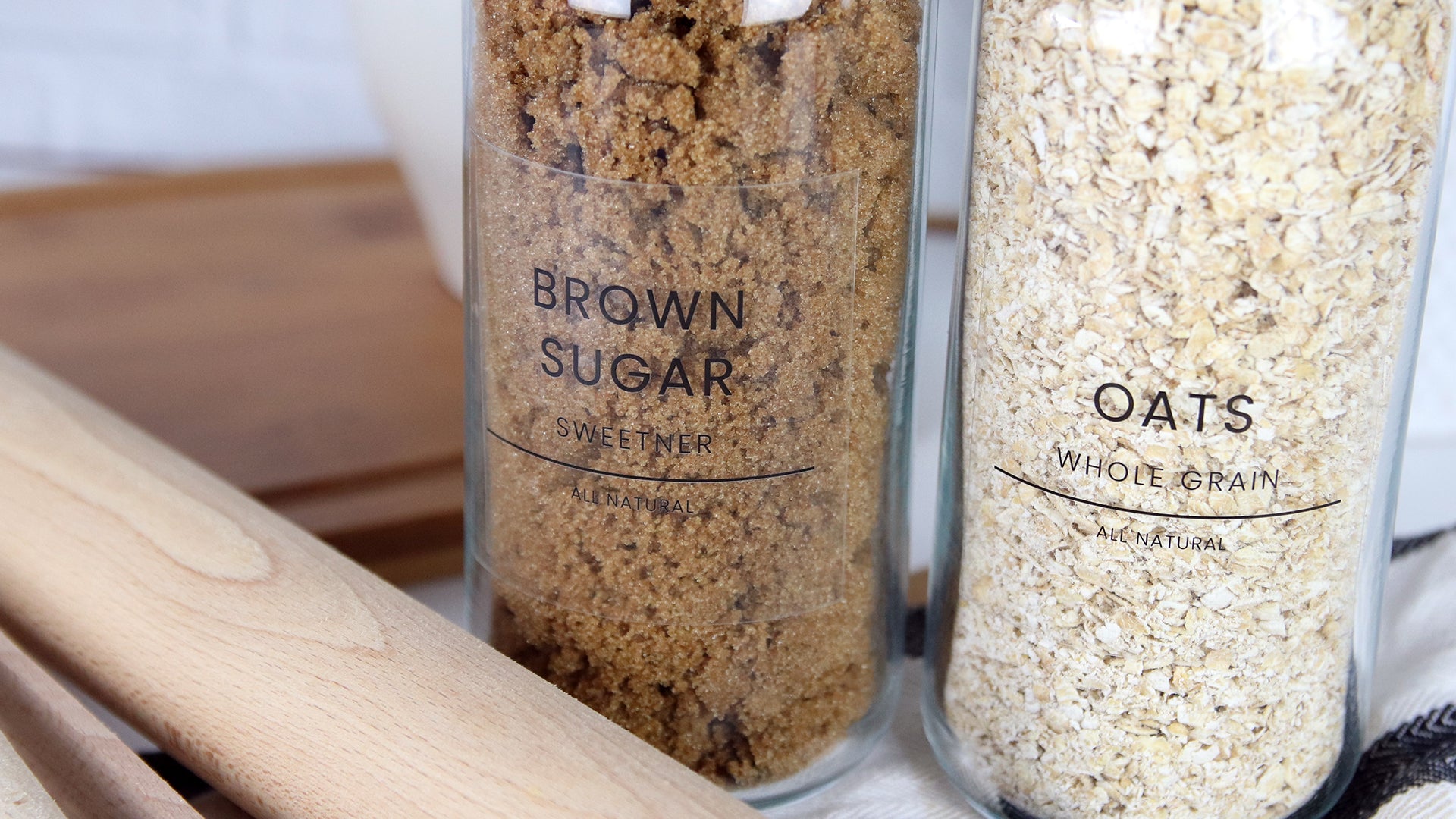 Clear glass labels applied to glass containers with brown sugar and oats