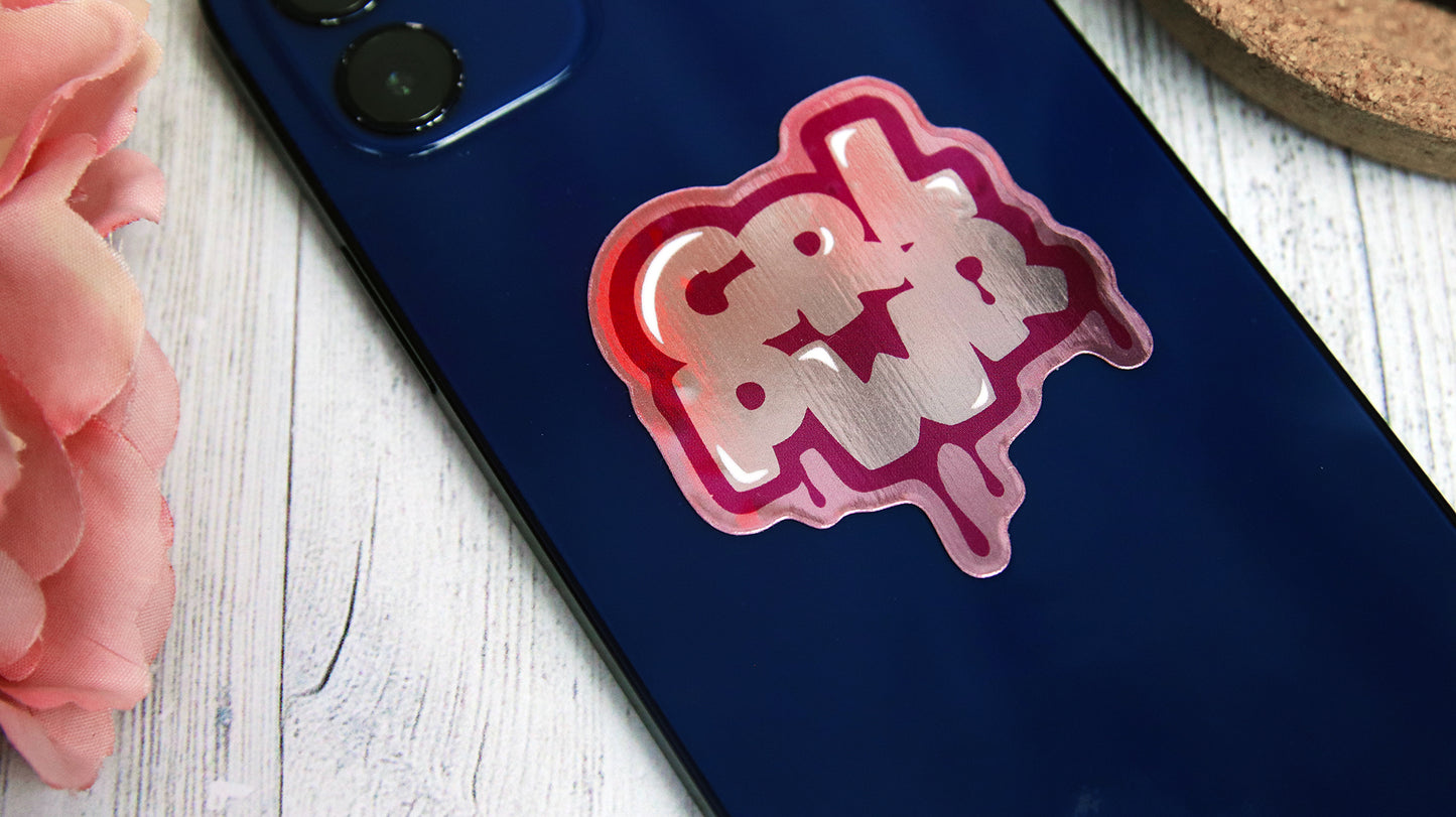 Die cut eco-friendly silver sticker with girl power logo applied to a blue iPhone