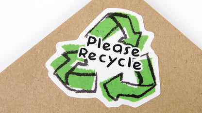 Die cut eco-friendly stickers with recycling design applied to a cardboard envelope