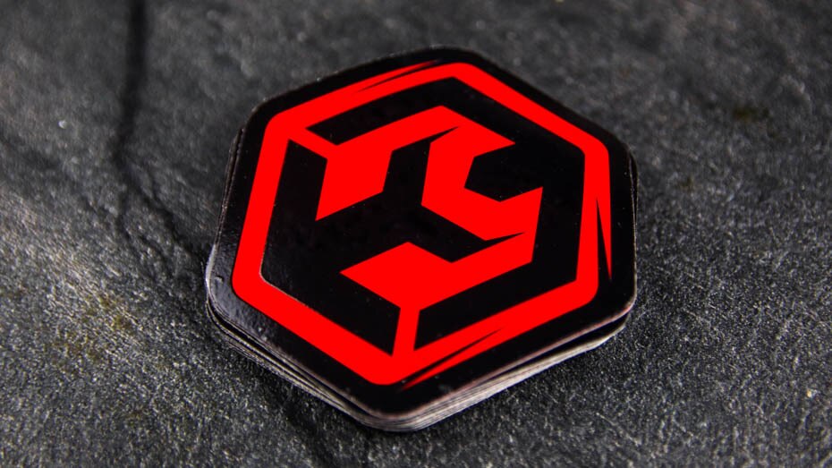 Die cut fluorescent red labels on a table