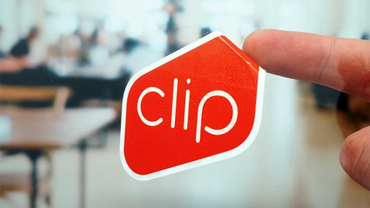 Die cut front adhesive sticker sample with clip logo applied to a window