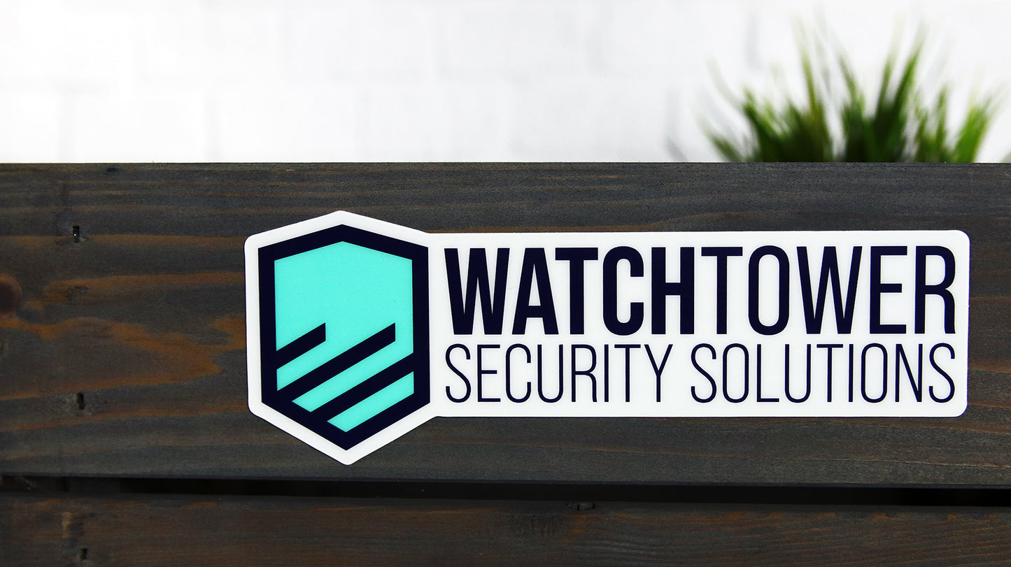 Die cut heavy duty sticker with watchtower security logo applied to wood