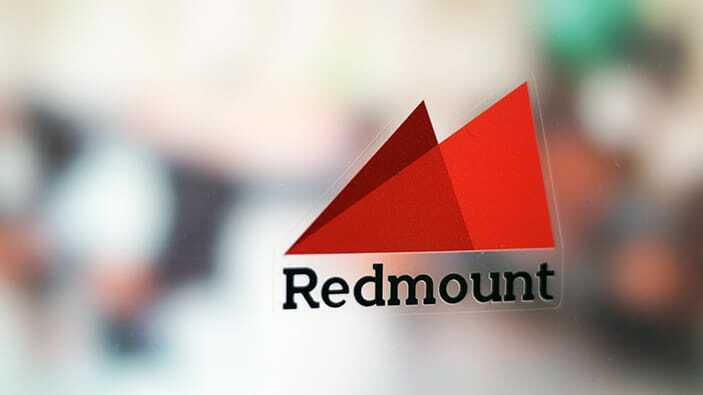 Die cut static cling sample with redmount logo applied to a window