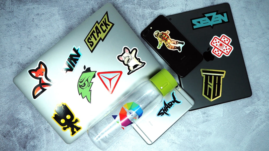 Die cut stickers applied to a laptop notebook and water bottle