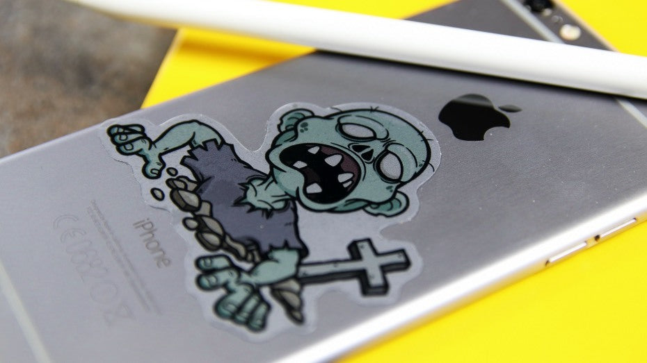 Die cut transparent sticker with zombie design applied to iPhone