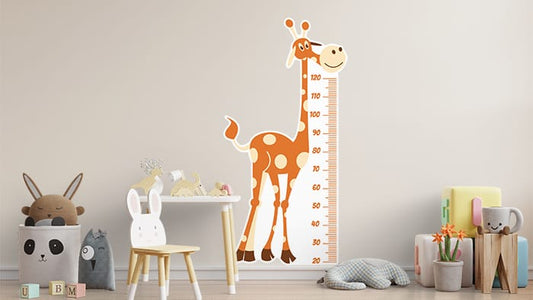 Die cut wall stickers with giraffe design applied to a nursery