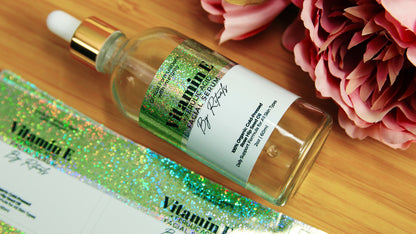 Eco-friendly glitter labels with vitamin e design and one label applied to a glass bottle