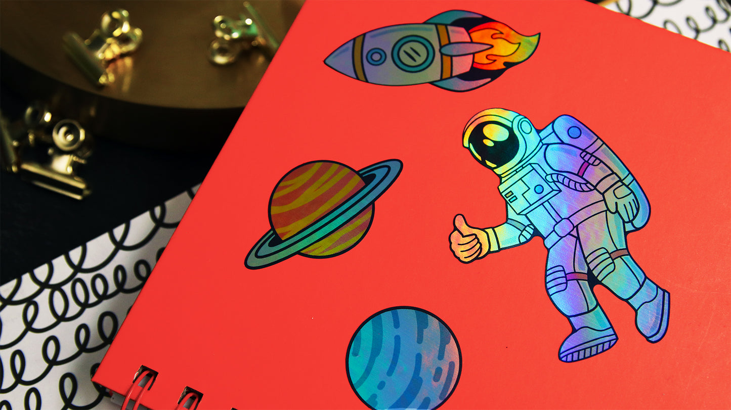 Eco-friendly holographic samples with various space designs applied to a red notebook