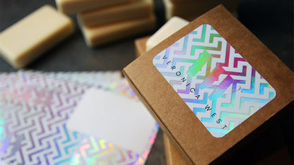 Holographic label with rounded corners applied to a cardboard soap box