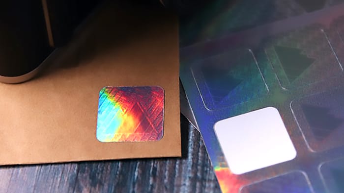 Holographic sheet labels used as die cut security labels