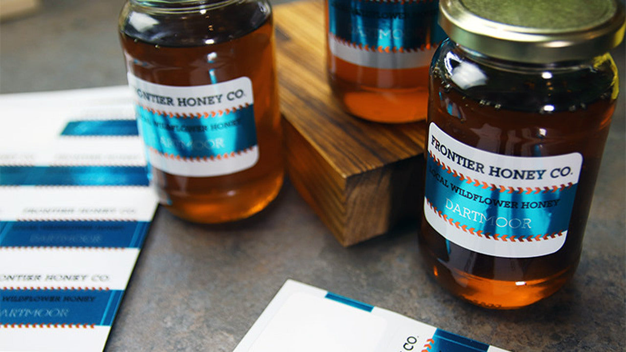 Mirror silver sheet waterproof labels applied to honey jars