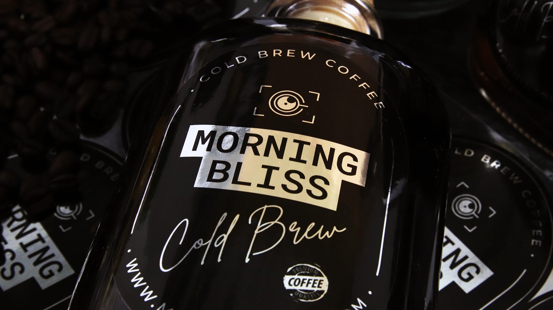 Oval mirror silver bottle label with morning bliss design applied to a glass bottle with cold brew coffee
