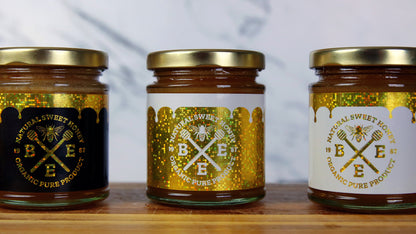 Rectangle glitter labels in different colours used as honey jar labels