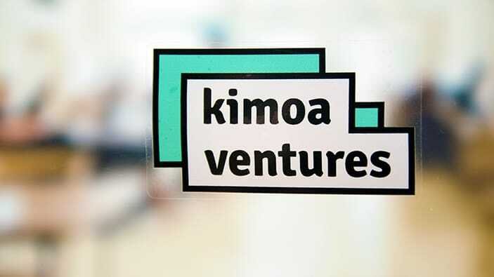 Rectangular static cling sample with kimoa logo applied to a window