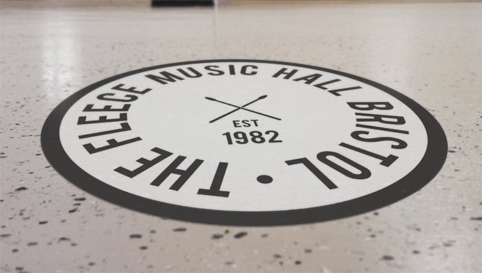 Round floor sticker applied to a floor in the Bristol music hall