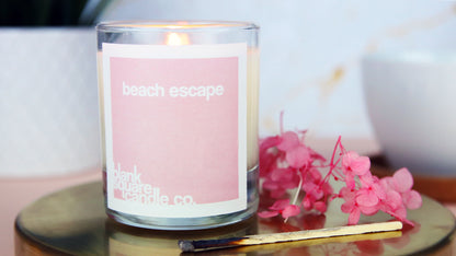 Square biodegradable paper label applied to a white candle jar