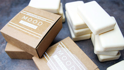 Square eco-friendly clear sheet labels applied to a cardboard soap box