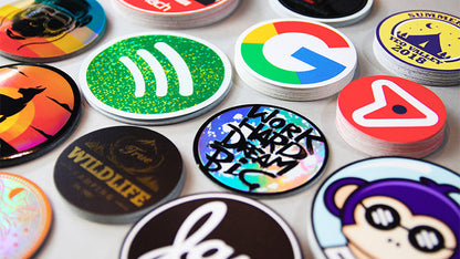Piles of circle stickers on a light grey table