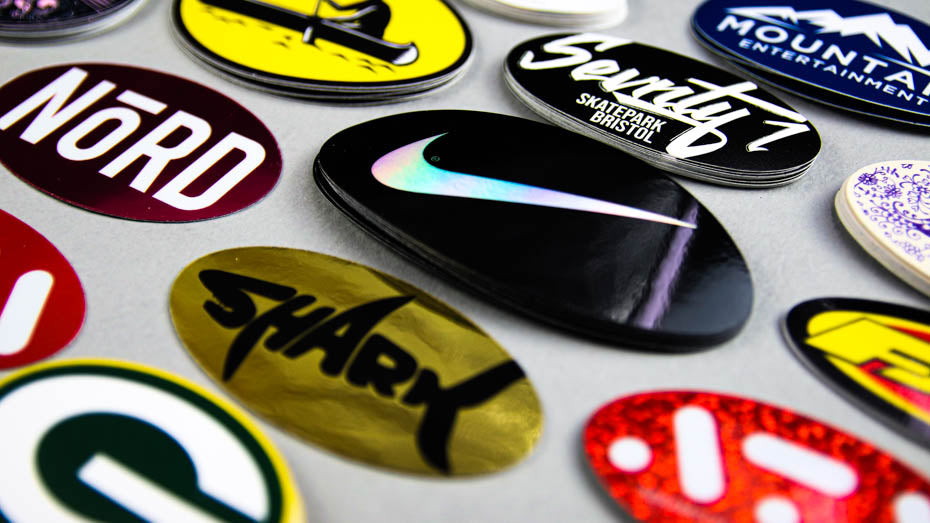 Piles of oval stickers on a light grey table