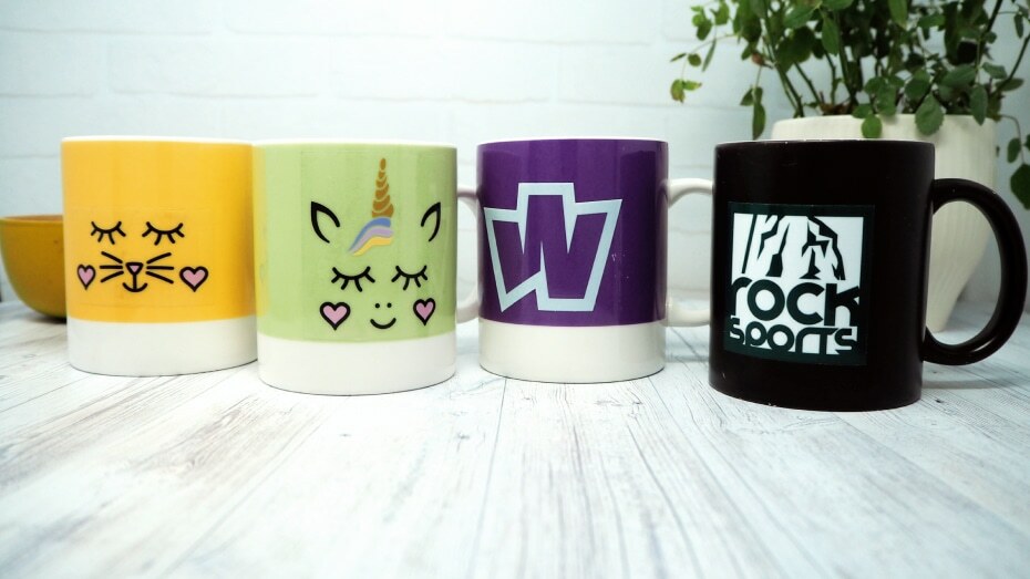 Various mug stickers applied to different mugs
