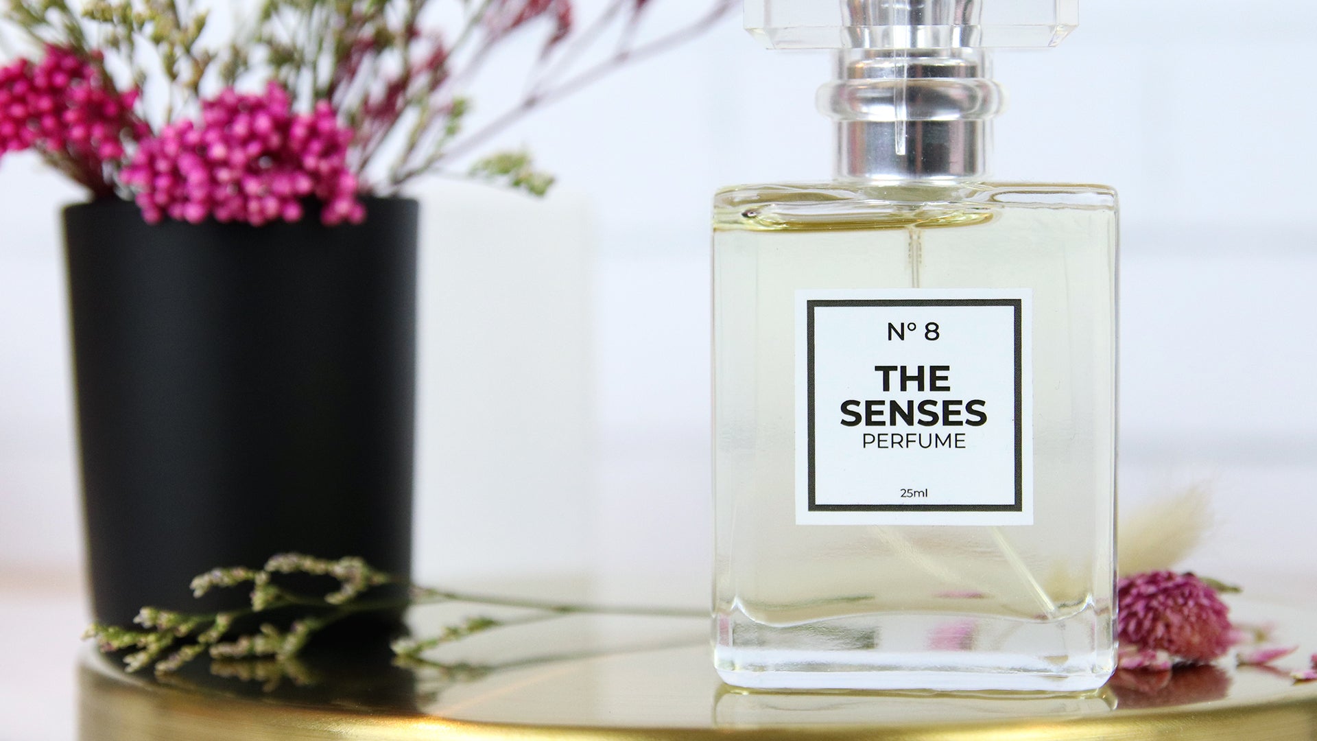 White vinyl cosmetic label applied to perfume bottle